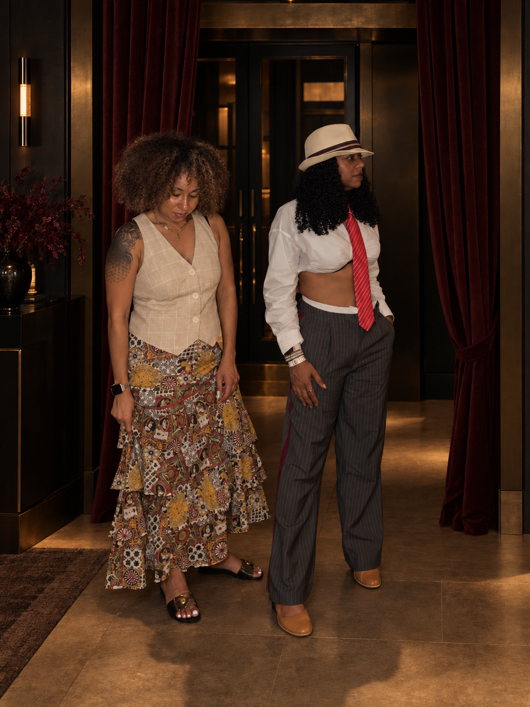 Editorial portrait of Shinavia McKinney and Precious "Preciosa" Myers-Brown in a velvet-lined salon